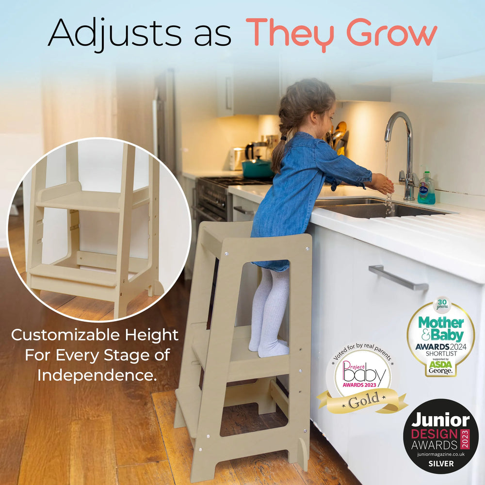 adjustable toddler tower  positioned at kitchen sink for easy reach